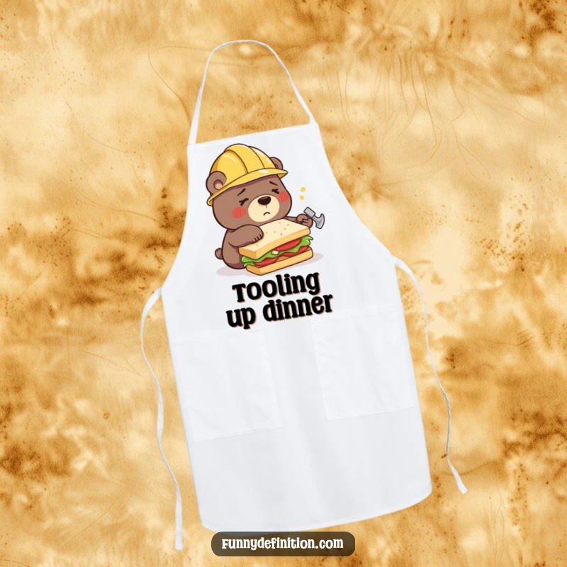 Funny apron featuring a confused bear in a construction helmet, hilariously attempting to build a sandwich using a hammer, a chef's humorous challenge.