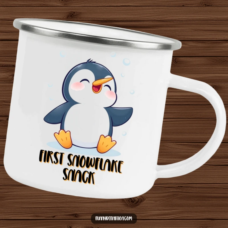 Funny camping mug featuring a happy penguin enthusiastically trying to catch falling snowflakes with its beak, ideal for campfire mornings.
