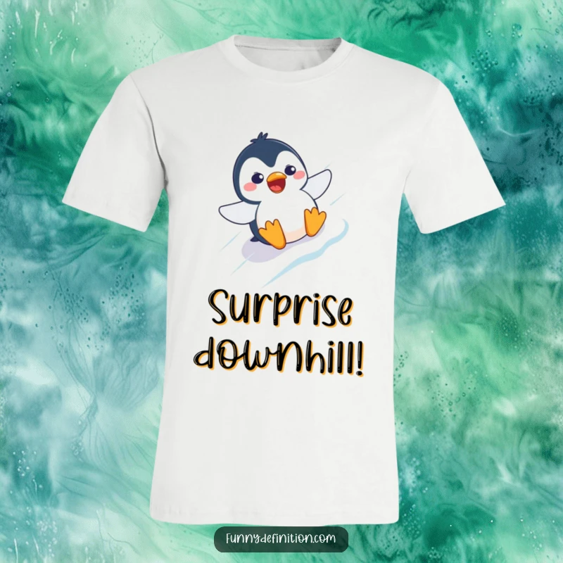 Funny t-shirt featuring a startled penguin with wide eyes and an open beak, sliding down an icy slope.